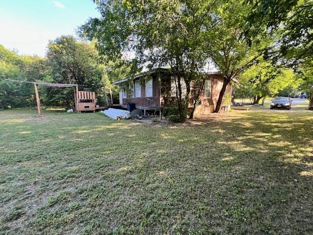 908 Glass Dr, Leander, TX 78641 - view of green lawn featuring a deck