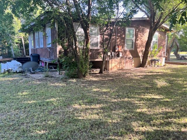 908 Glass Dr, Leander, TX 78641 - back of house featuring a yard