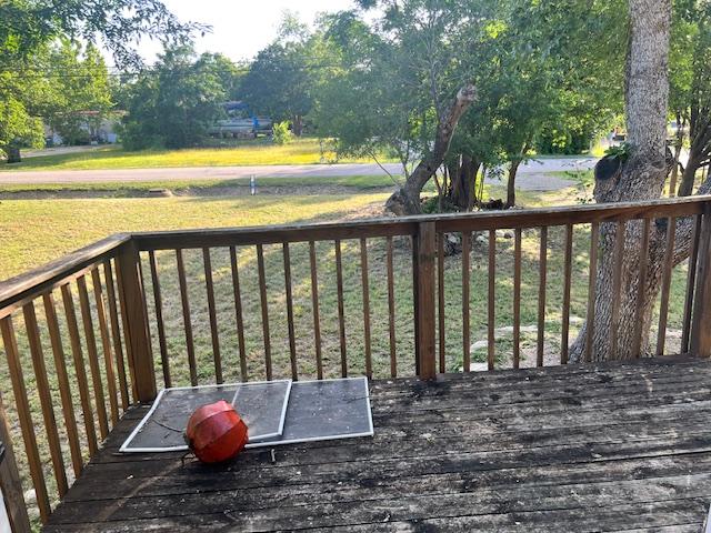 908 Glass Dr, Leander, TX 78641 - wooden deck featuring a lawn
