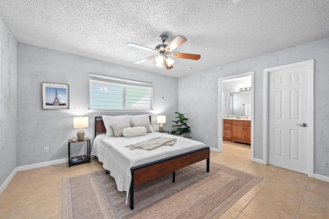 8 Spalding Cir, Wimberley, TX 78676 - bedroom featuring light tile patterned floors, a textured wall, ensuite bath, ceiling fan, and a textured ceiling