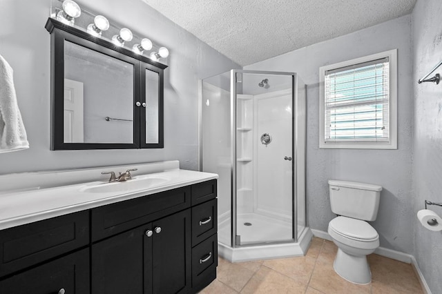 8 Spalding Cir, Wimberley, TX 78676 - bathroom featuring a textured ceiling, a stall shower, vanity, and tile patterned flooring