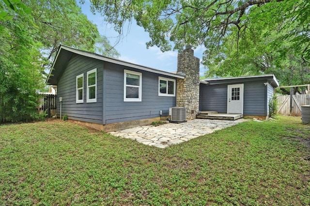 8 Spalding Cir, Wimberley, TX 78676 - back of house with a chimney and a patio