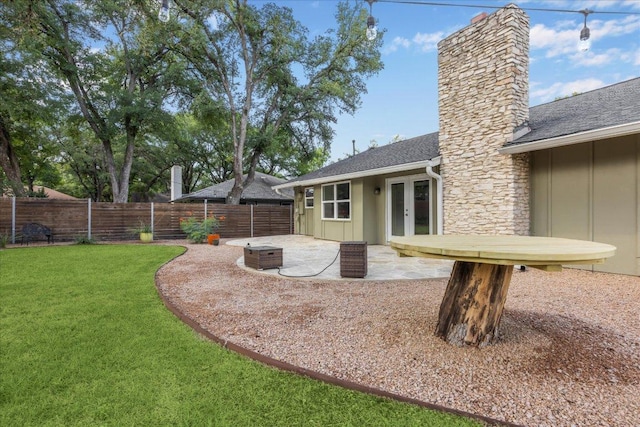 2701 Coatbridge Dr, Austin, TX 78745 - back of house with board and batten siding, a patio area, a fenced backyard, a chimney, and french doors