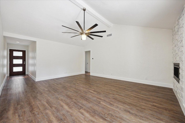 2701 Coatbridge Dr, Austin, TX 78745 - unfurnished living room featuring ceiling fan, a stone fireplace, and dark wood-style flooring