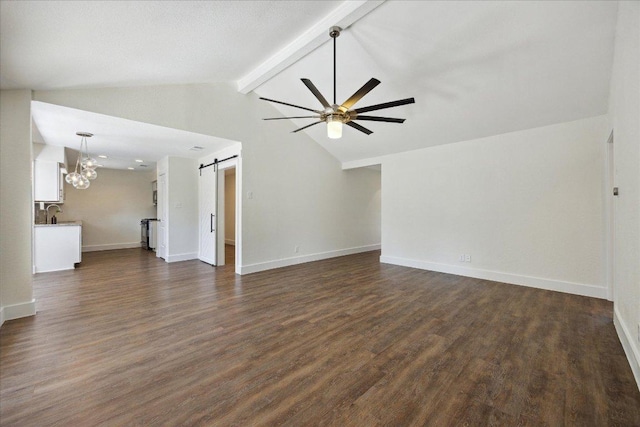 2701 Coatbridge Dr, Austin, TX 78745 - unfurnished living room featuring a barn door, a ceiling fan, dark wood-style floors, and a chandelier