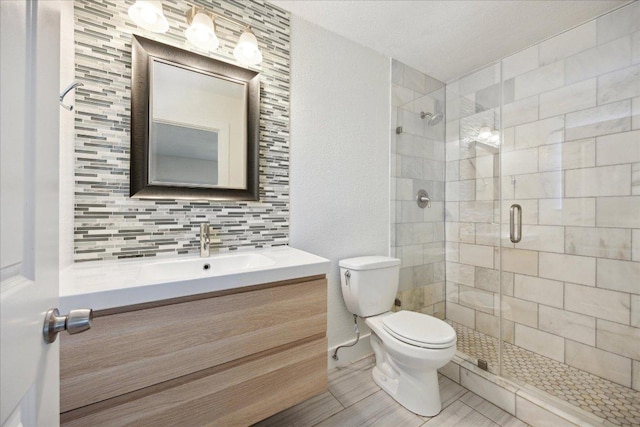 2701 Coatbridge Dr, Austin, TX 78745 - bathroom featuring vanity, a stall shower, and tasteful backsplash