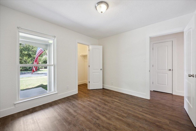 2701 Coatbridge Dr, Austin, TX 78745 - unfurnished room with dark wood-style flooring and baseboards