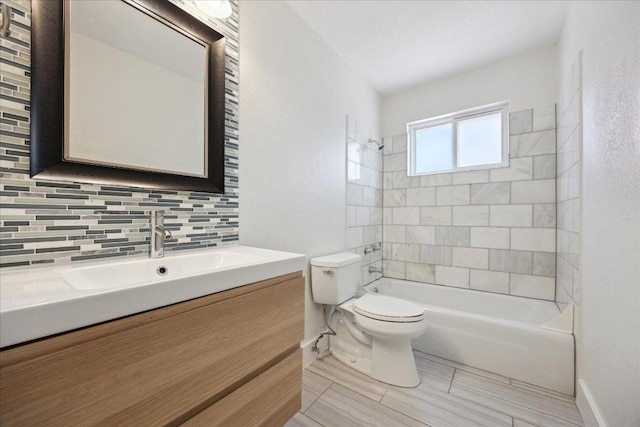 2701 Coatbridge Dr, Austin, TX 78745 - bathroom with vanity, decorative backsplash, and tub / shower combination