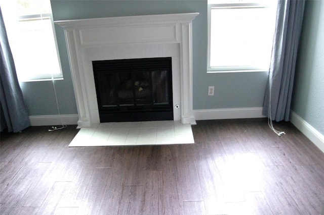 12615 Dove Valley Trl, Austin, TX 78729 - detailed view of wood finished floors and a glass covered fireplace