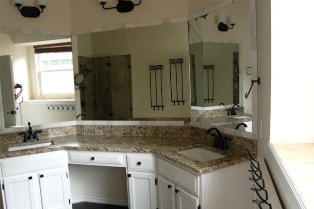 12615 Dove Valley Trl, Austin, TX 78729 - bathroom featuring a shower stall and double vanity