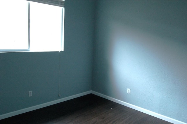 12615 Dove Valley Trl, Austin, TX 78729 - spare room with dark wood finished floors and baseboards
