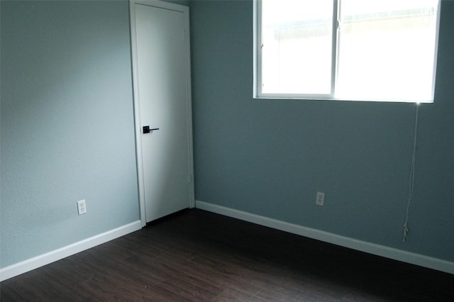 12615 Dove Valley Trl, Austin, TX 78729 - spare room featuring dark wood-style floors and baseboards
