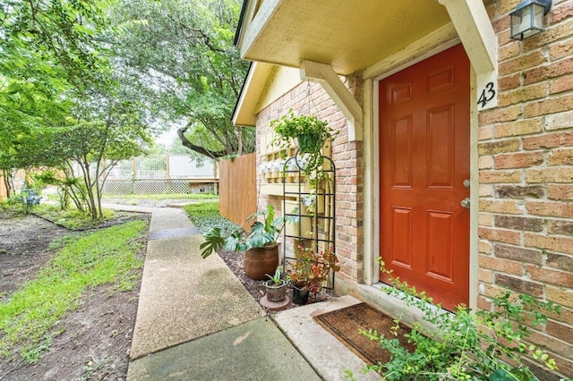 11901 Swearingen Dr Unit 43-I, Austin, TX 78758 - view of exterior entry with brick siding