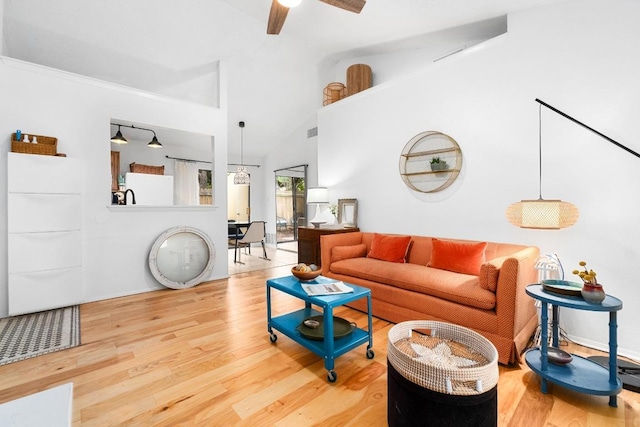 11901 Swearingen Dr Unit 43-I, Austin, TX 78758 - living area featuring wood finished floors, a ceiling fan, and high vaulted ceiling