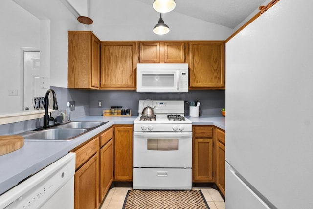 11901 Swearingen Dr Unit 43-I, Austin, TX 78758 - kitchen featuring white appliances, light countertops, vaulted ceiling, and light tile patterned floors
