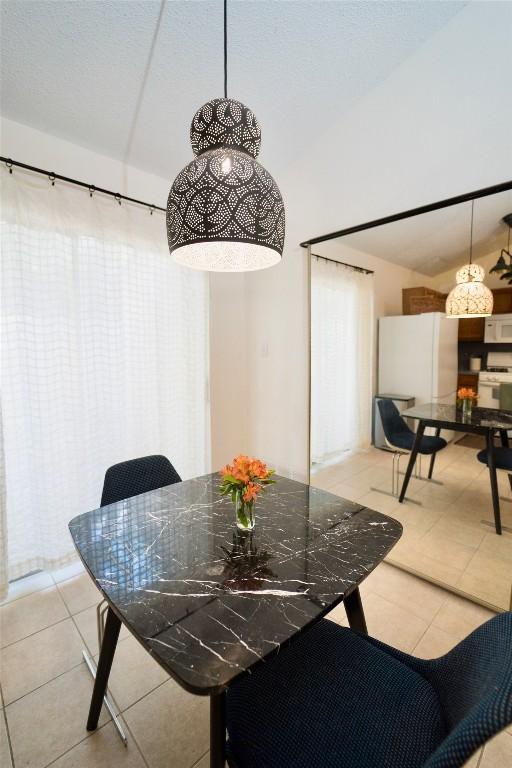 11901 Swearingen Dr Unit 43-I, Austin, TX 78758 - dining room with light tile patterned floors