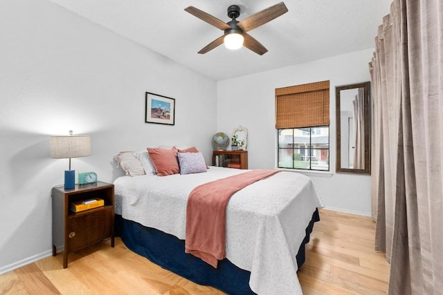 11901 Swearingen Dr Unit 43-I, Austin, TX 78758 - bedroom featuring light wood finished floors and ceiling fan