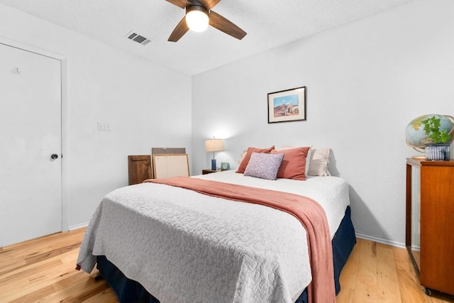 11901 Swearingen Dr Unit 43-I, Austin, TX 78758 - bedroom with light wood-type flooring and a ceiling fan