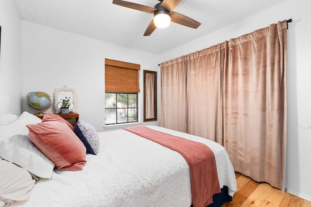 11901 Swearingen Dr Unit 43-I, Austin, TX 78758 - bedroom featuring wood finished floors and a ceiling fan