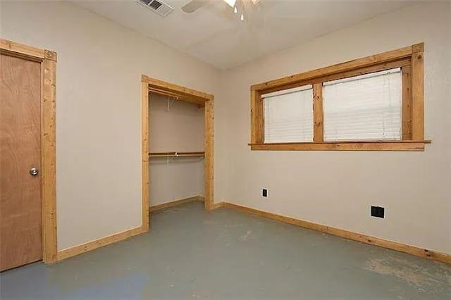 4901 County Road 210, Bertram, TX 78605 - unfurnished bedroom featuring concrete floors, a closet, and a ceiling fan
