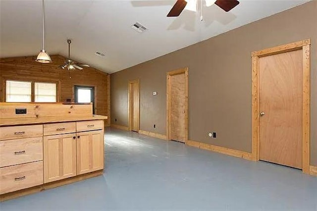 4901 County Road 210, Bertram, TX 78605 - kitchen with a ceiling fan, finished concrete floors, lofted ceiling, decorative light fixtures, and light countertops