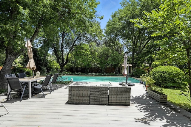 7314 Danwood Dr, Austin, TX 78759 - outdoor pool featuring a wooden deck and view of scattered trees