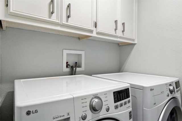 7314 Danwood Dr, Austin, TX 78759 - washroom featuring washer and dryer and cabinet space