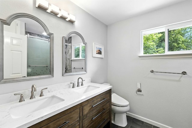 7314 Danwood Dr, Austin, TX 78759 - bathroom with plenty of natural light, double vanity, and a shower
