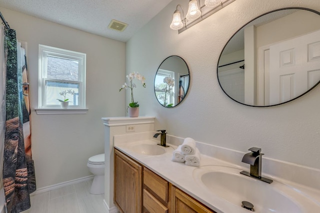 1104 Woodhollow Ln, Cedar Park, TX 78613 - full bath featuring double vanity, a shower with shower curtain, and a textured ceiling