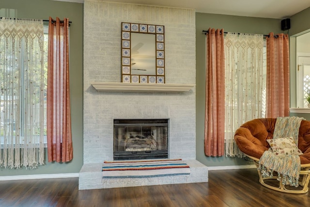 1104 Woodhollow Ln, Cedar Park, TX 78613 - living area featuring wood finished floors and a brick fireplace