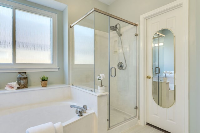 1104 Woodhollow Ln, Cedar Park, TX 78613 - full bathroom with healthy amount of natural light, a shower stall, and a garden tub