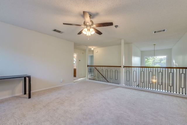1104 Woodhollow Ln, Cedar Park, TX 78613 - unfurnished room with a ceiling fan, carpet, and a textured ceiling