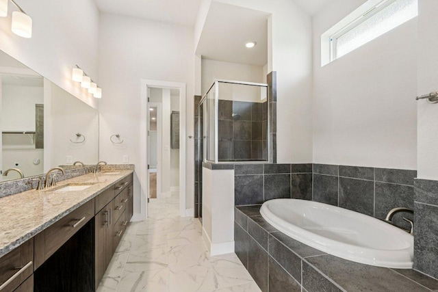 181 Benedum Way, Liberty Hill, TX 78642 - full bathroom featuring a bath, marble look tiles, a stall shower, and double vanity