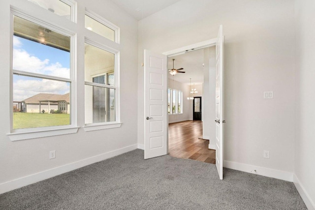 181 Benedum Way, Liberty Hill, TX 78642 - carpeted spare room with baseboards and ceiling fan