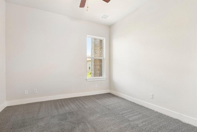 181 Benedum Way, Liberty Hill, TX 78642 - unfurnished room featuring a ceiling fan and dark carpet
