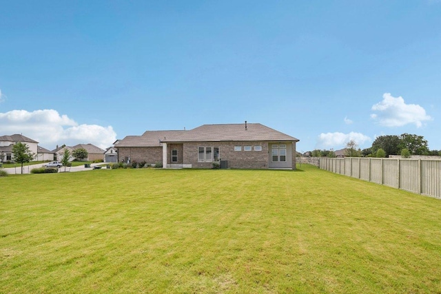 181 Benedum Way, Liberty Hill, TX 78642 - rear view of house featuring brick siding