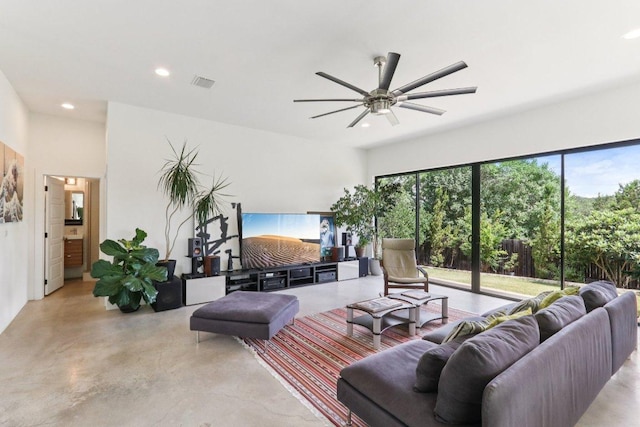 13008 Medina River Way, Austin, TX 78732 - living area featuring concrete floors, recessed lighting, plenty of natural light, and ceiling fan
