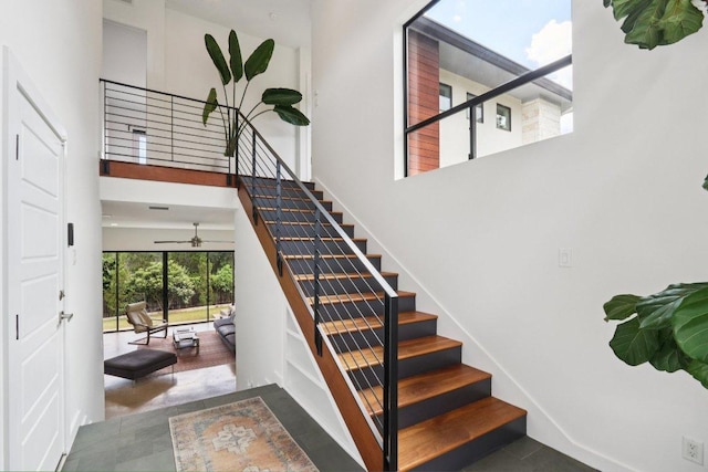 13008 Medina River Way, Austin, TX 78732 - stairway with a towering ceiling and ceiling fan