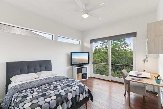 13008 Medina River Way, Austin, TX 78732 - bedroom with wood finished floors, access to outside, a desk, and a ceiling fan