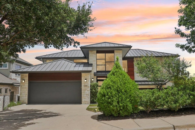 13008 Medina River Way, Austin, TX 78732 - contemporary home with a standing seam roof, a metal roof, and stone siding