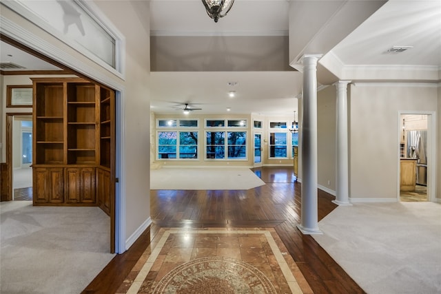 24205 State Highway 71 W, Spicewood, TX 78669 - foyer with decorative columns, ornamental molding, inlaid floor details, ceiling fan, and wood finished floors