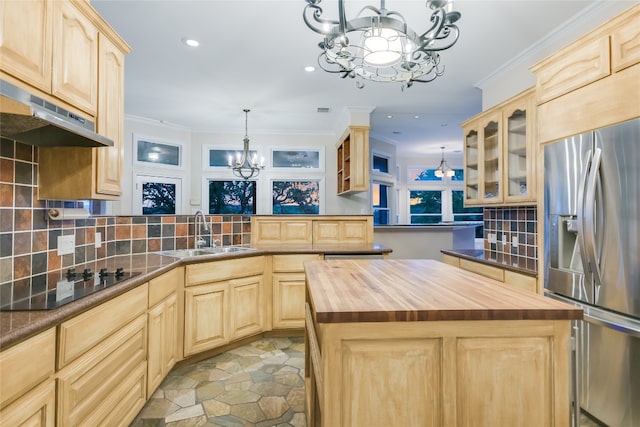 24205 State Highway 71 W, Spicewood, TX 78669 - kitchen featuring wooden counters, a chandelier, light brown cabinetry, recessed lighting, and crown molding