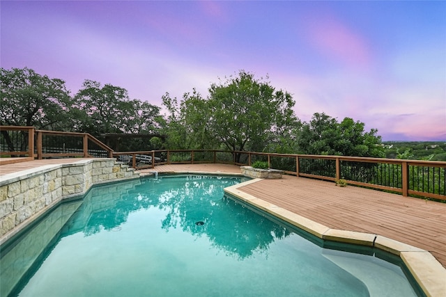 24205 State Highway 71 W, Spicewood, TX 78669 - pool at dusk with a wooden deck