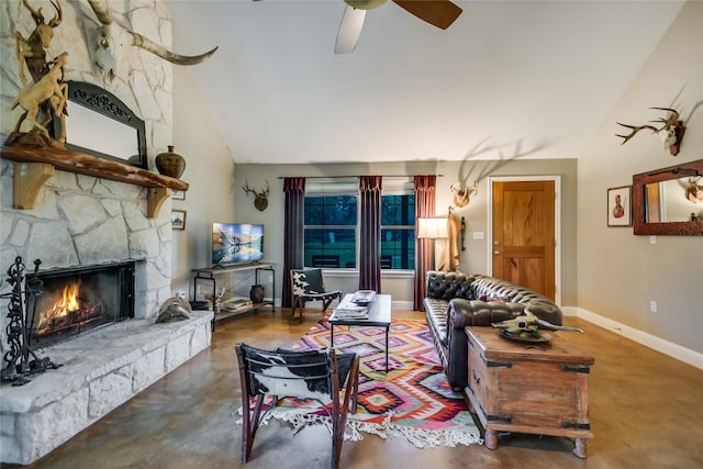 24205 State Highway 71 W, Spicewood, TX 78669 - living room featuring finished concrete floors, vaulted ceiling, a stone fireplace, and ceiling fan