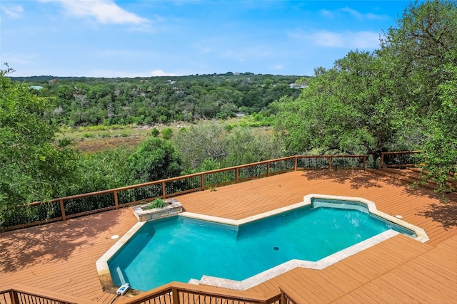 24205 State Highway 71 W, Spicewood, TX 78669 - view of swimming pool featuring a wooden deck and a forest view