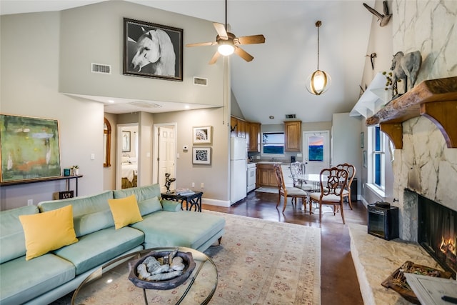 24205 State Highway 71 W, Spicewood, TX 78669 - living room featuring high vaulted ceiling, a fireplace, and ceiling fan