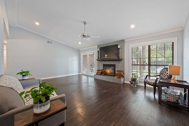 4310 Ponderosa Ln, Temple, TX 76502 - living room featuring ceiling fan, ornamental molding, a brick fireplace, wood finished floors, and lofted ceiling
