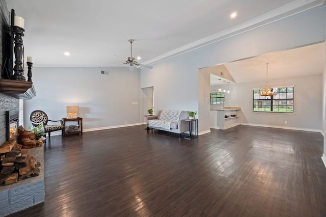 4310 Ponderosa Ln, Temple, TX 76502 - living area featuring a fireplace, a ceiling fan, a chandelier, dark wood finished floors, and ornamental molding