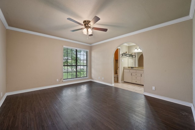 4310 Ponderosa Ln, Temple, TX 76502 - spare room featuring ceiling fan, light wood-style floors, arched walkways, and crown molding