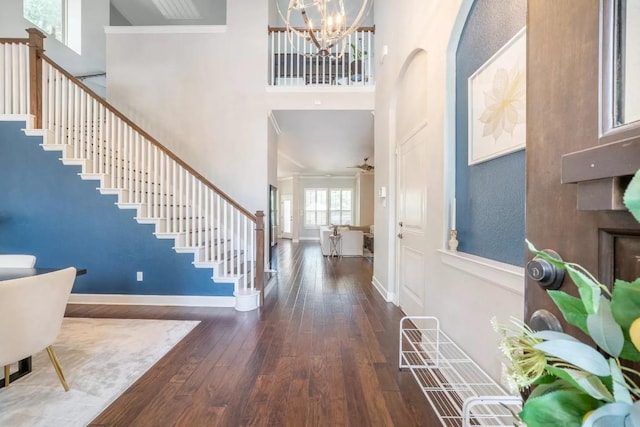 11612 Sierra Nevada, Austin, TX 78759 - foyer entrance featuring a towering ceiling, wood-type flooring, stairs, a chandelier, and crown molding